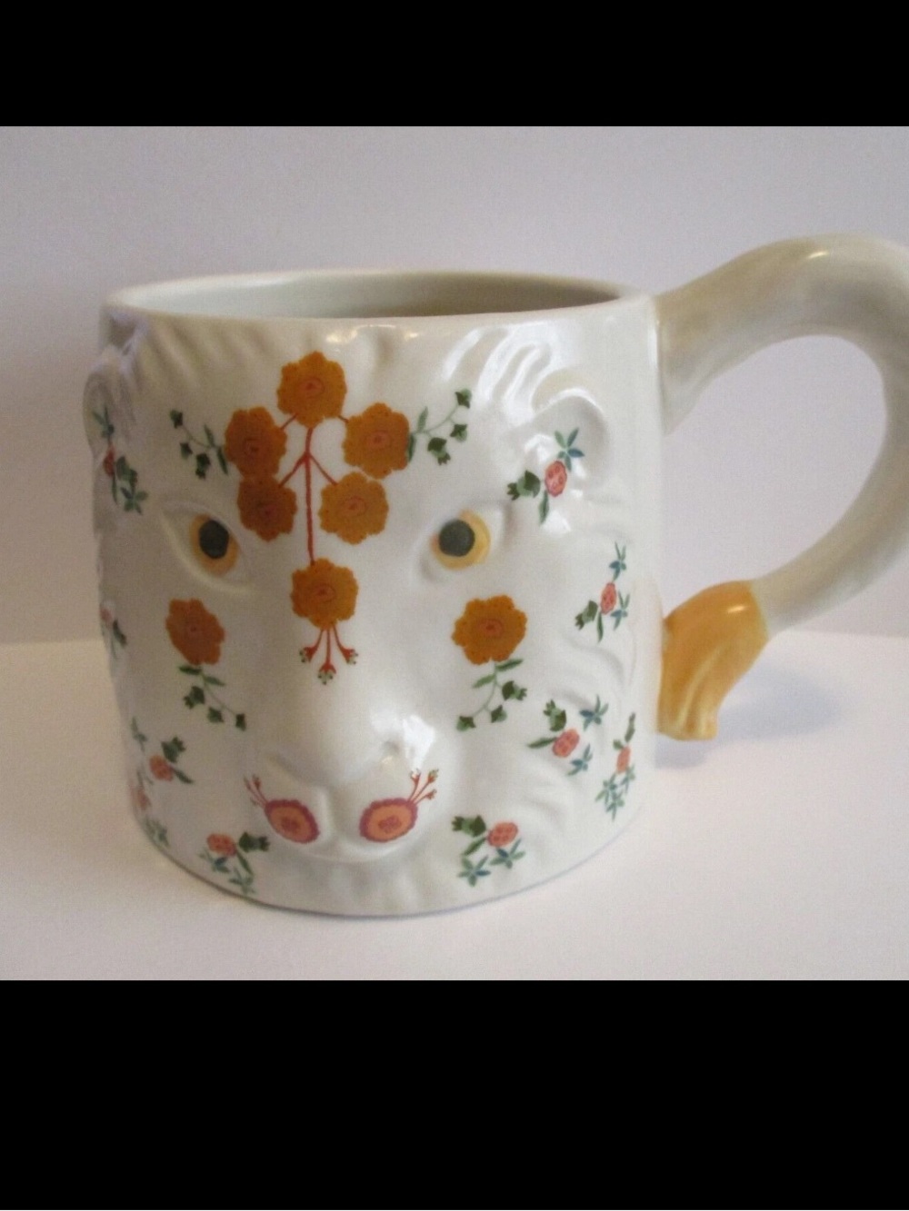 Anthropologie “Marisol Lion”  Motif and Green Leaves